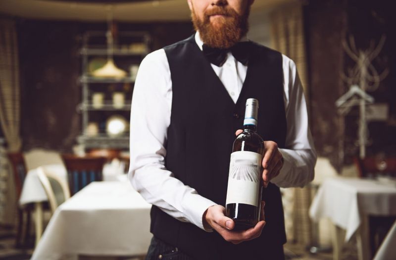 waitress serving wine